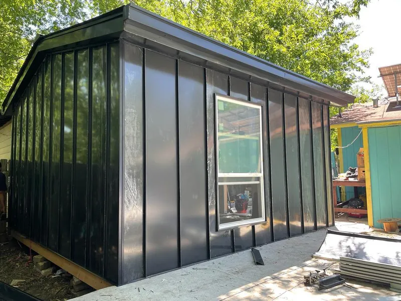 Black standing seam metal wall panels for Metal Roof Installation in Hitchcock